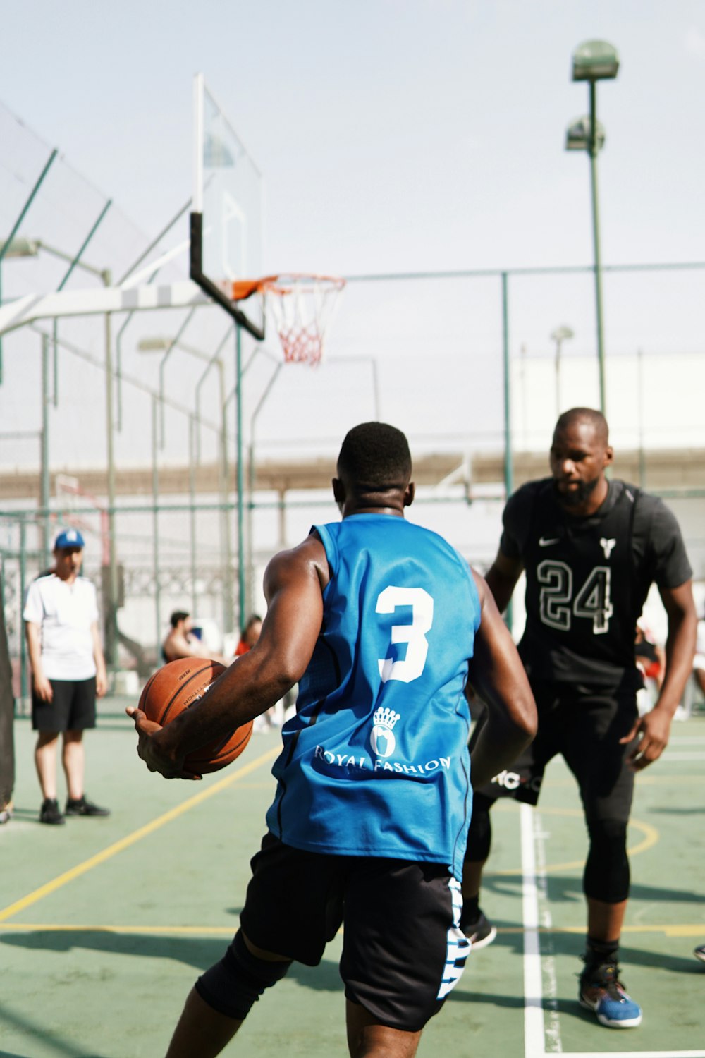 man in blue and white nike jersey shirt playing basketball