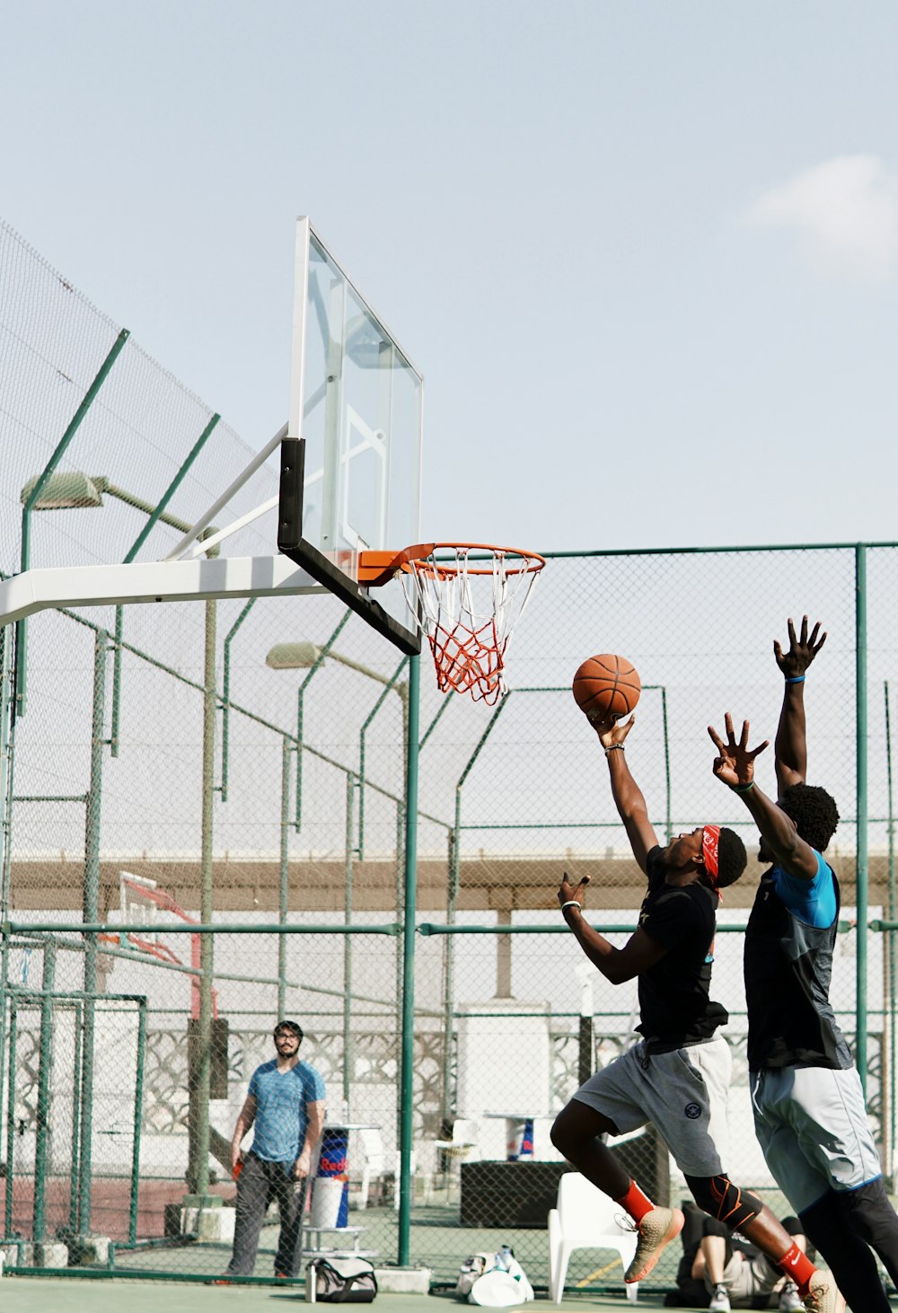 man in black t-shirt playing basketball