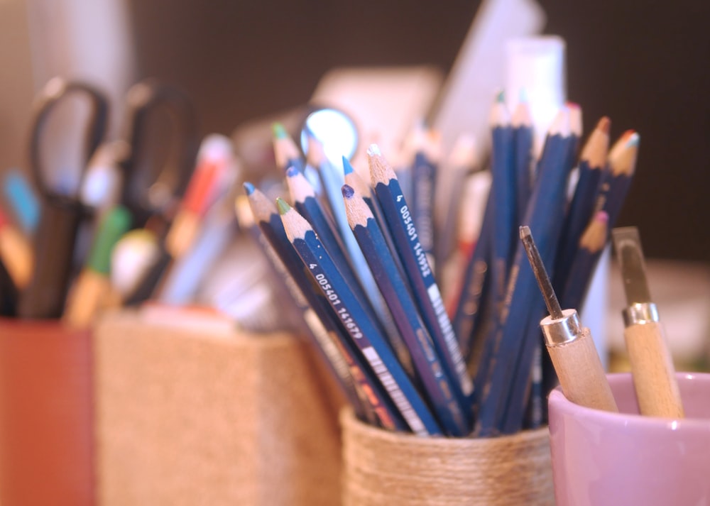 coloring pencils in brown woven basket