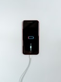 black iphone 5 on white surface