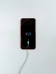 black iphone 5 on white surface