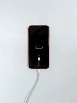 black iphone 5 on white surface