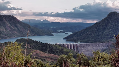 A panoramic view of the Vlasina hydropower dam nestled in lush Serbian hills.