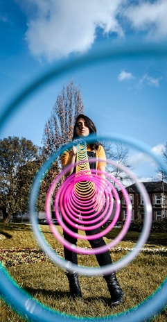 A joyful player winding a launcher with a Johnny Apple Springs torsion spring, capturing the moment before battle.