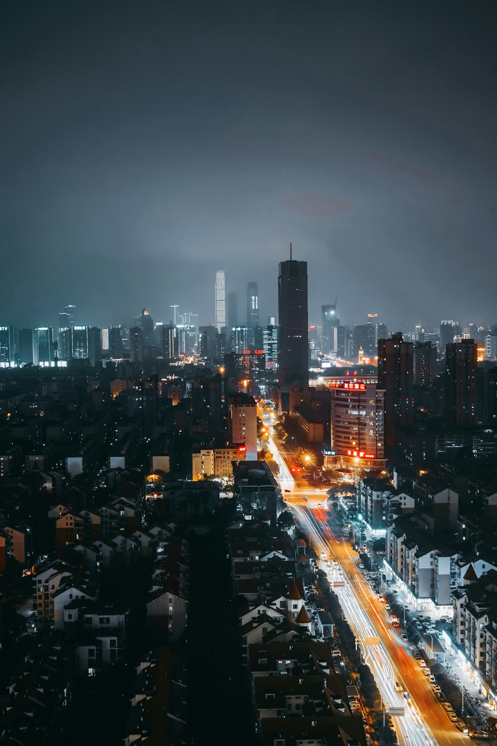 city with high rise buildings during night time