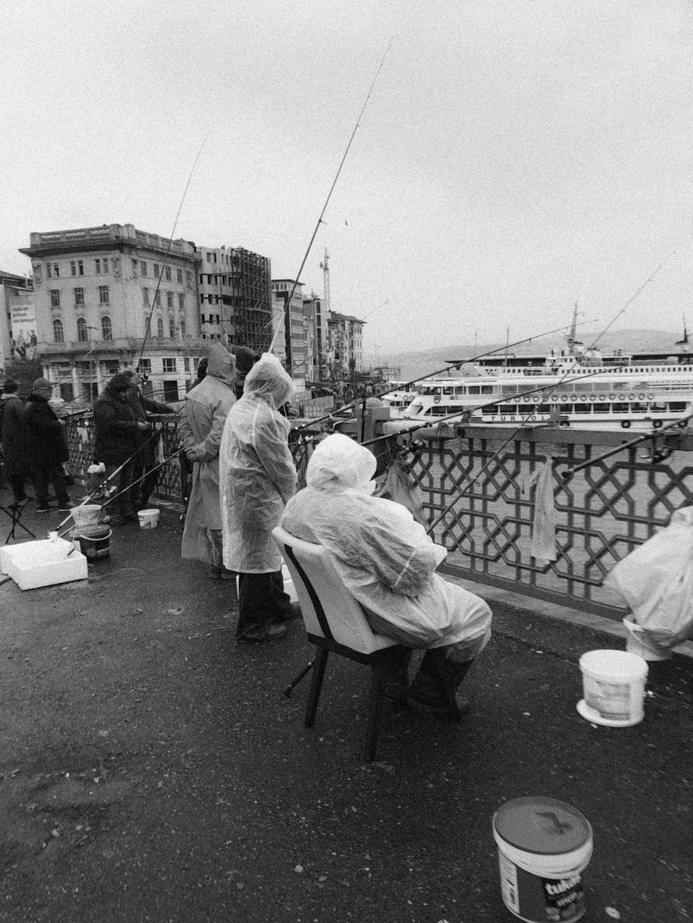 man in white robe sitting on chair