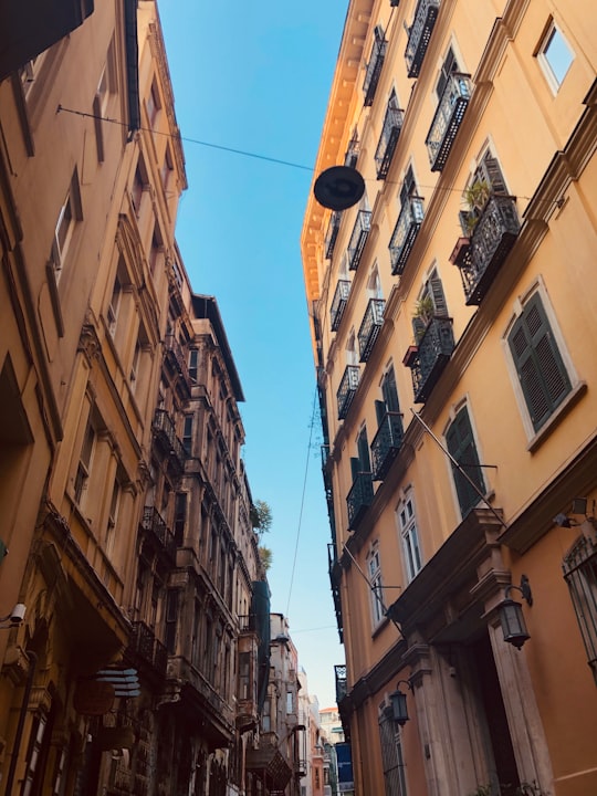 low angle photography of brown concrete building during daytime in Galata Tower Turkey