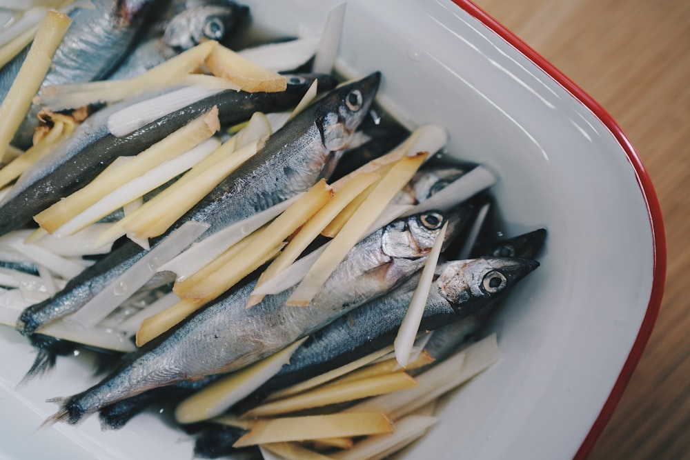 gray fish on white ceramic container