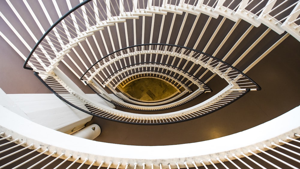 white spiral staircase with white metal railings