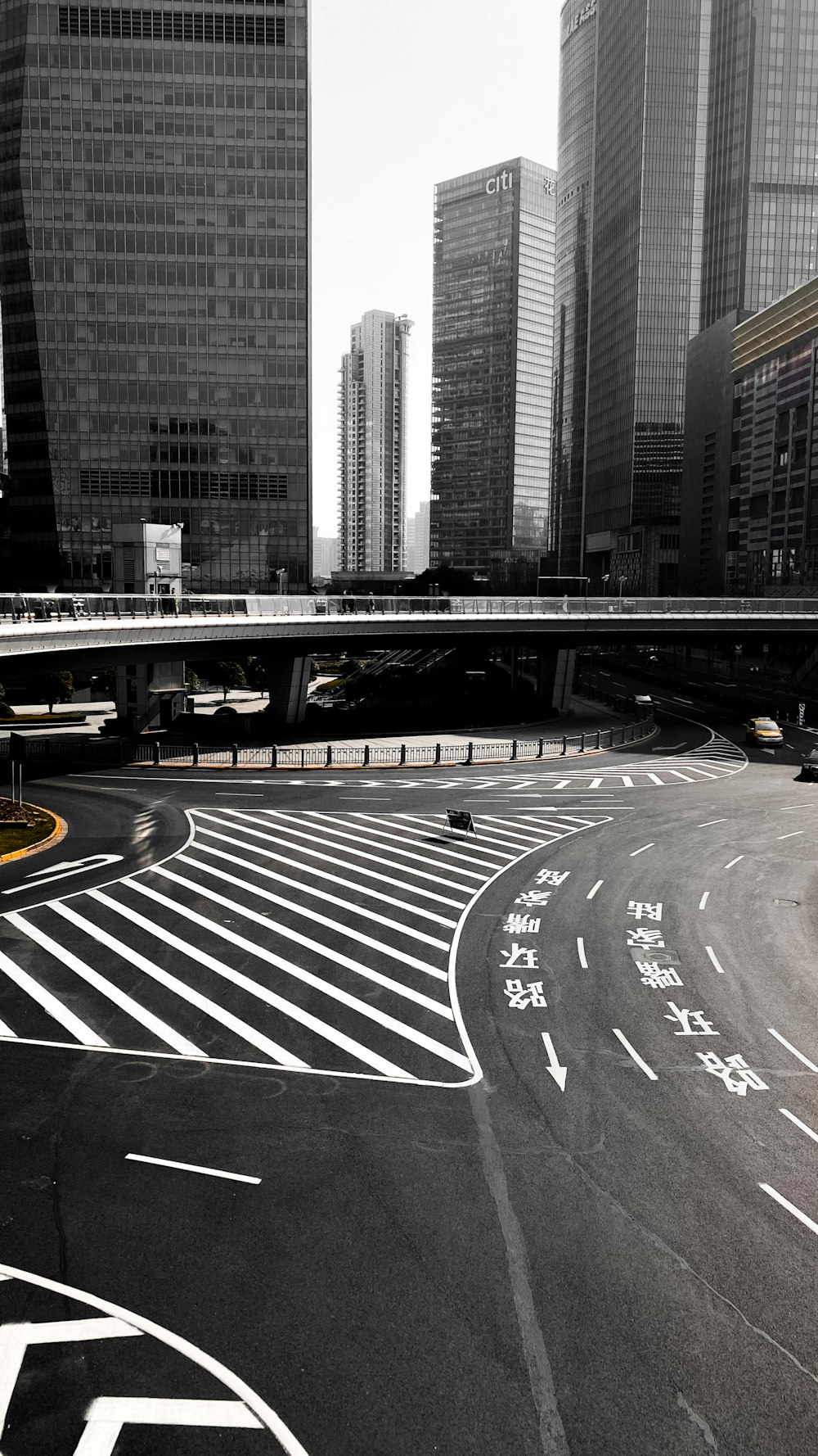 gray concrete road with cars on the side