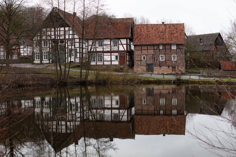 brown and white concrete building near body of water during daytime