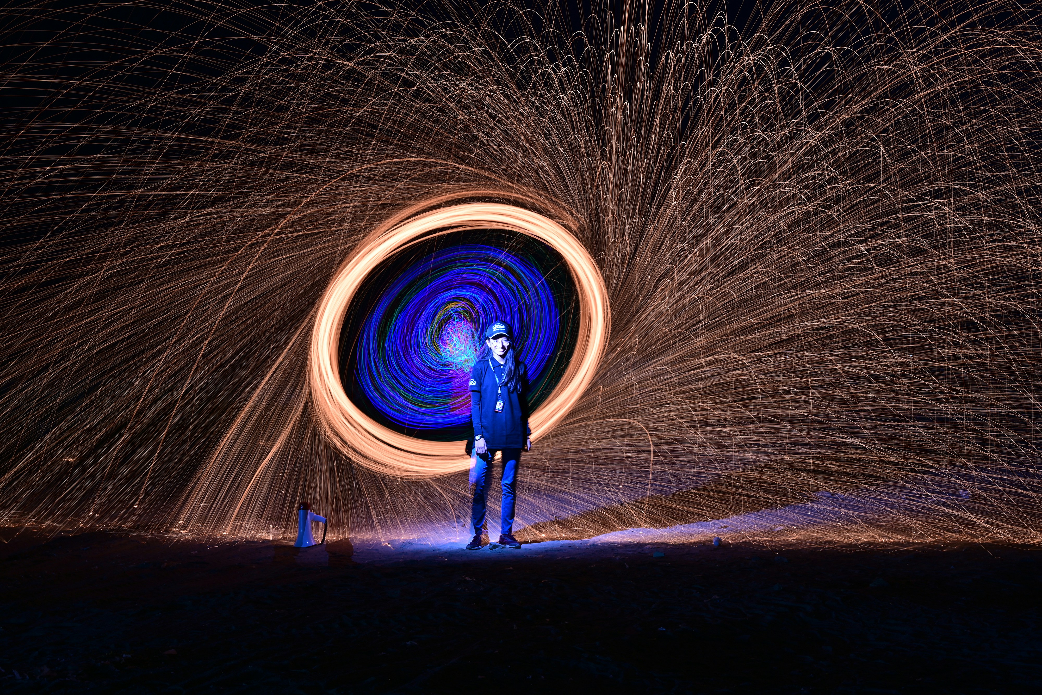 man in blue jacket standing on steel wool photography