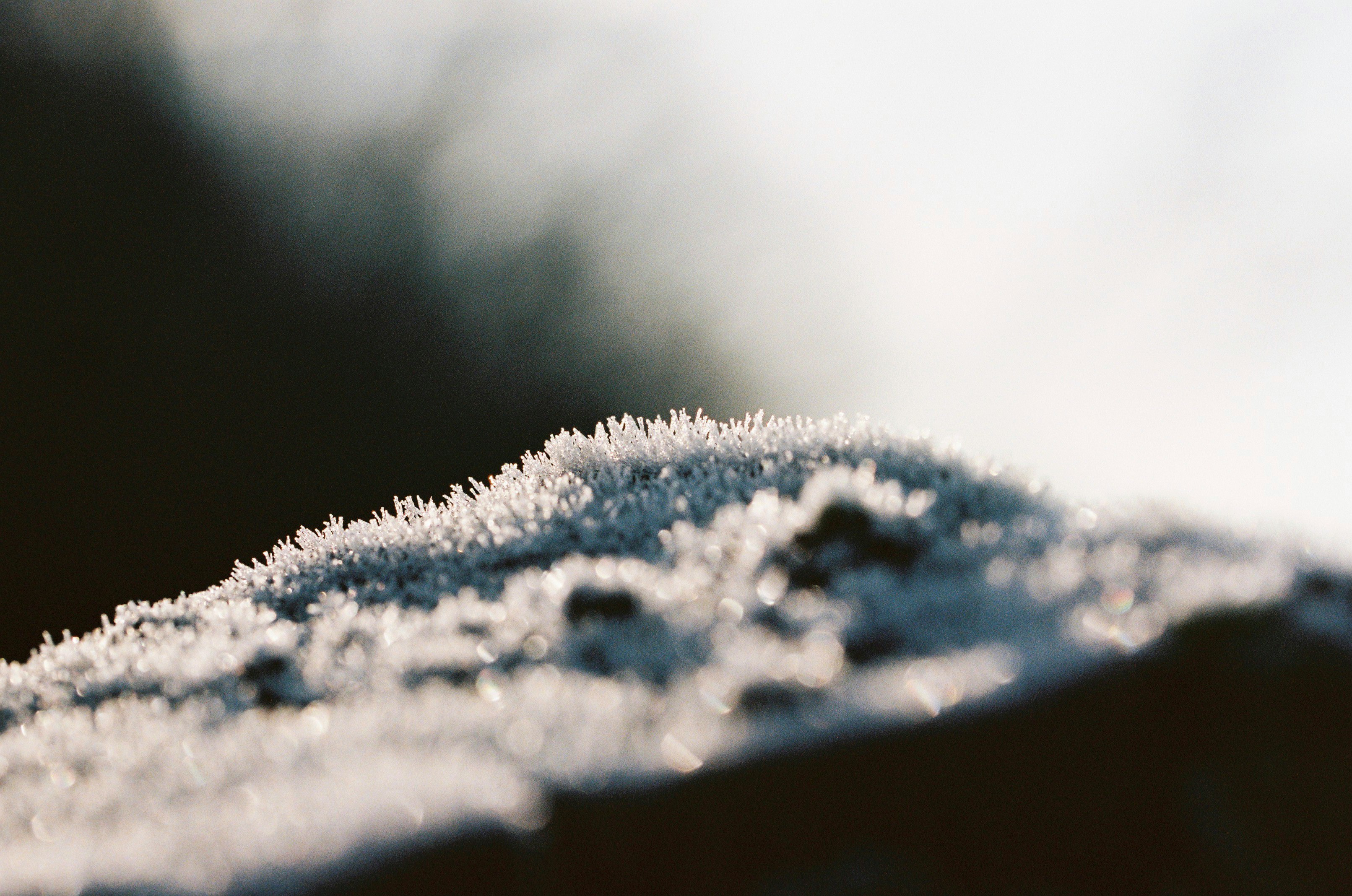 white snow on brown wooden table