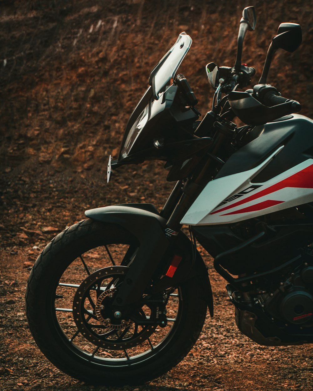 white and red honda sports bike