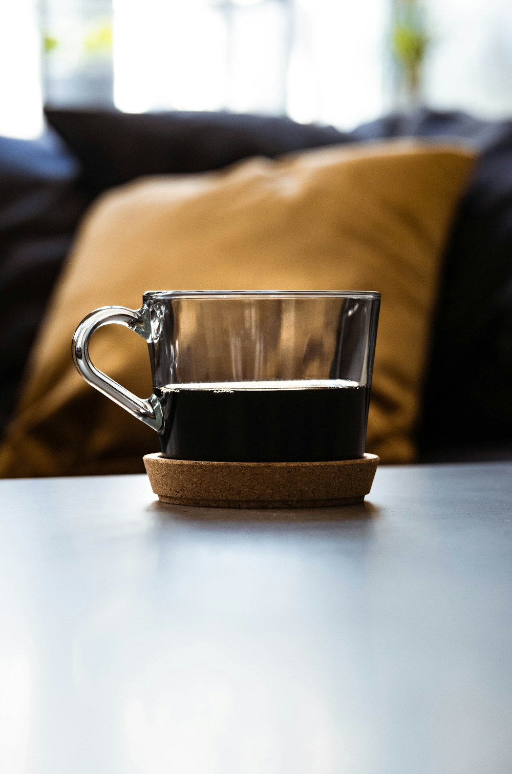 black and silver mug on white table