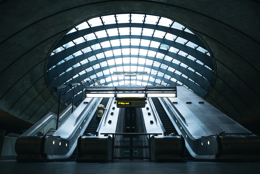 white and black train in a tunnel