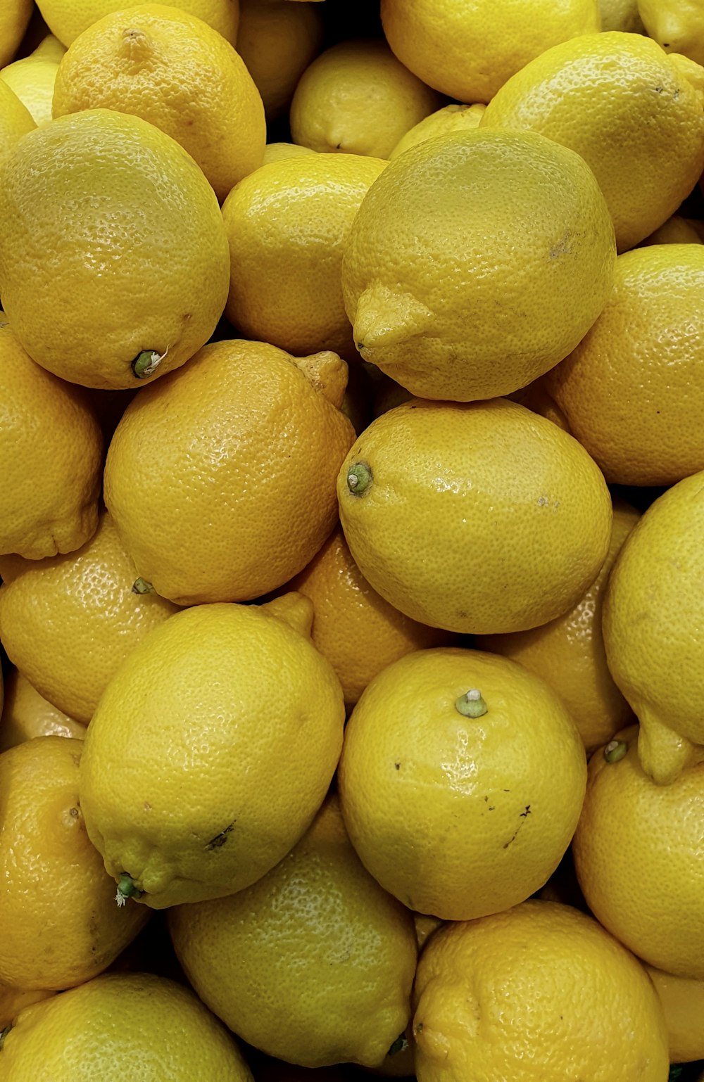 yellow citrus fruit on black surface