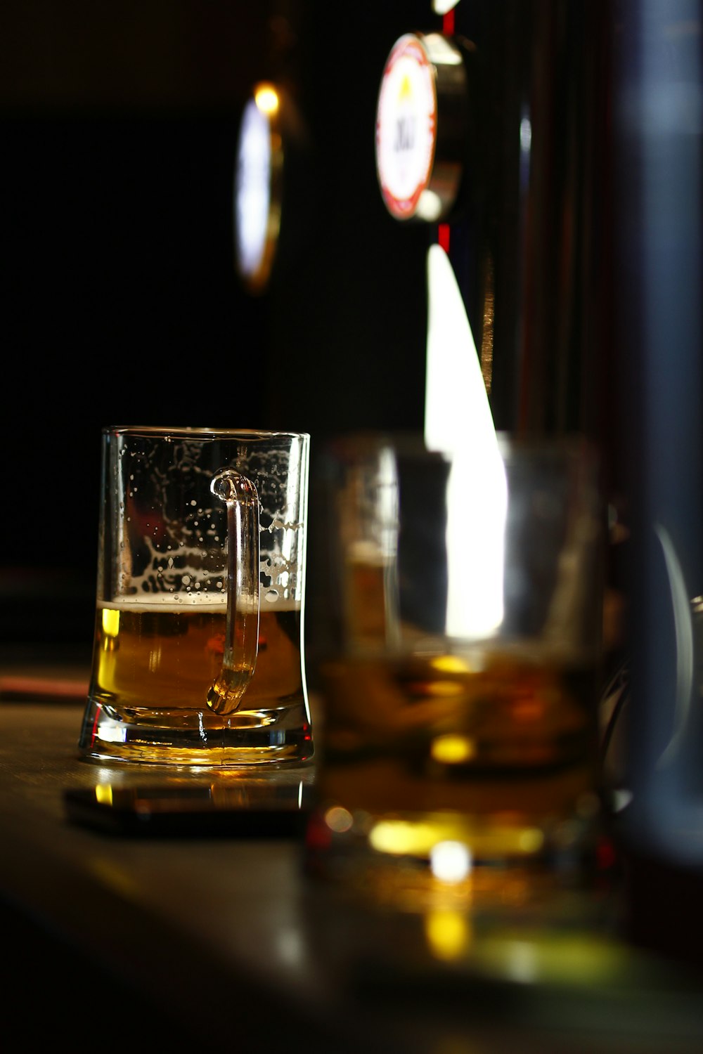 clear drinking glass with brown liquid