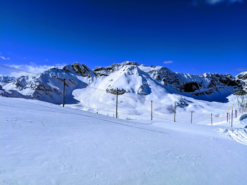 snow covered mountain under blue sky during daytime