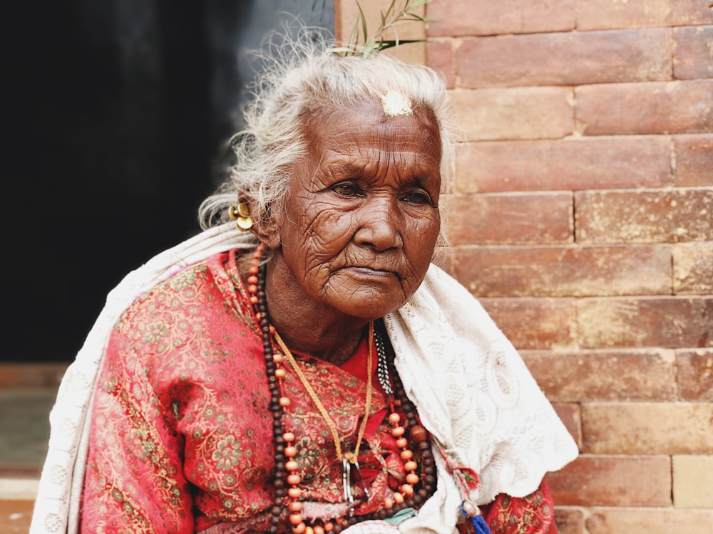 woman in red and white floral dress