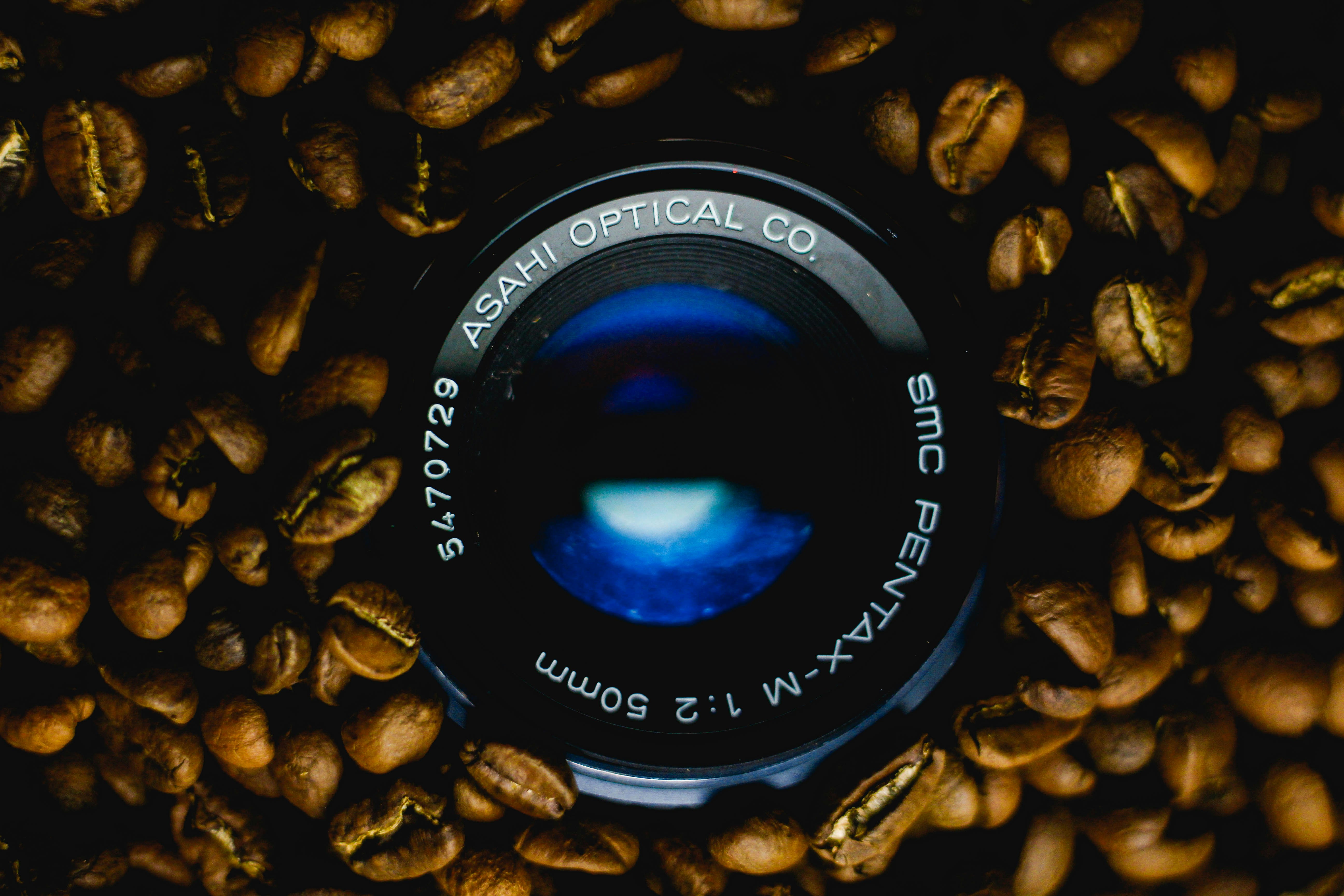 black camera lens on brown and black textile