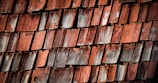 Different roof pitches on a cedar roof highlighting varied aging patterns.
