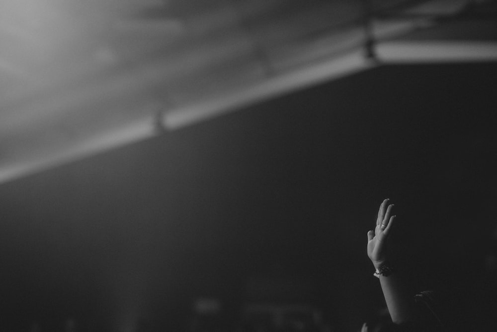 grayscale photo of persons hand