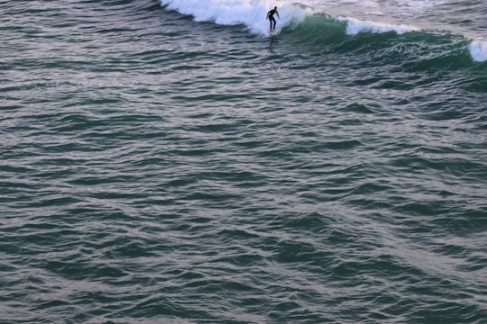man surfing on sea waves during daytime in Belle-Île-en-Mer France
