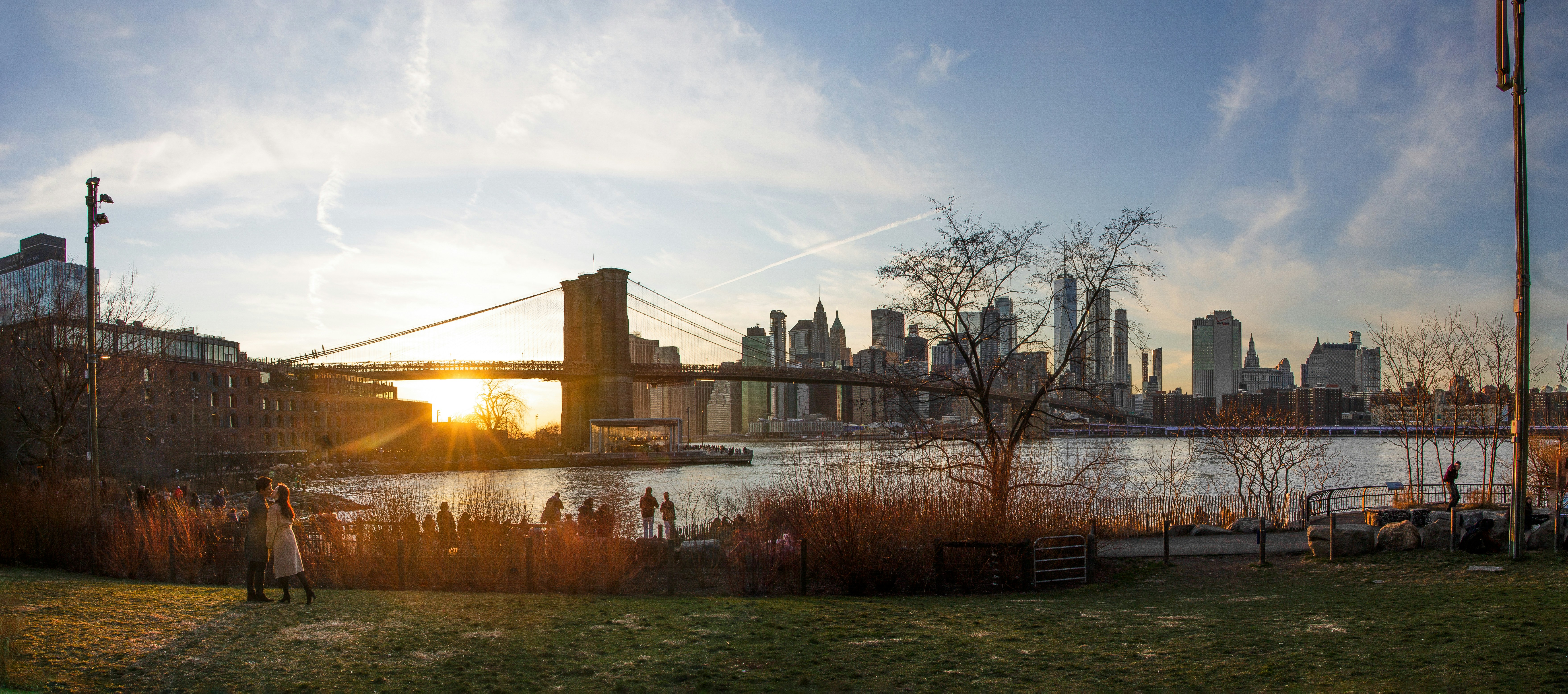 brown concrete building near bridge during daytime