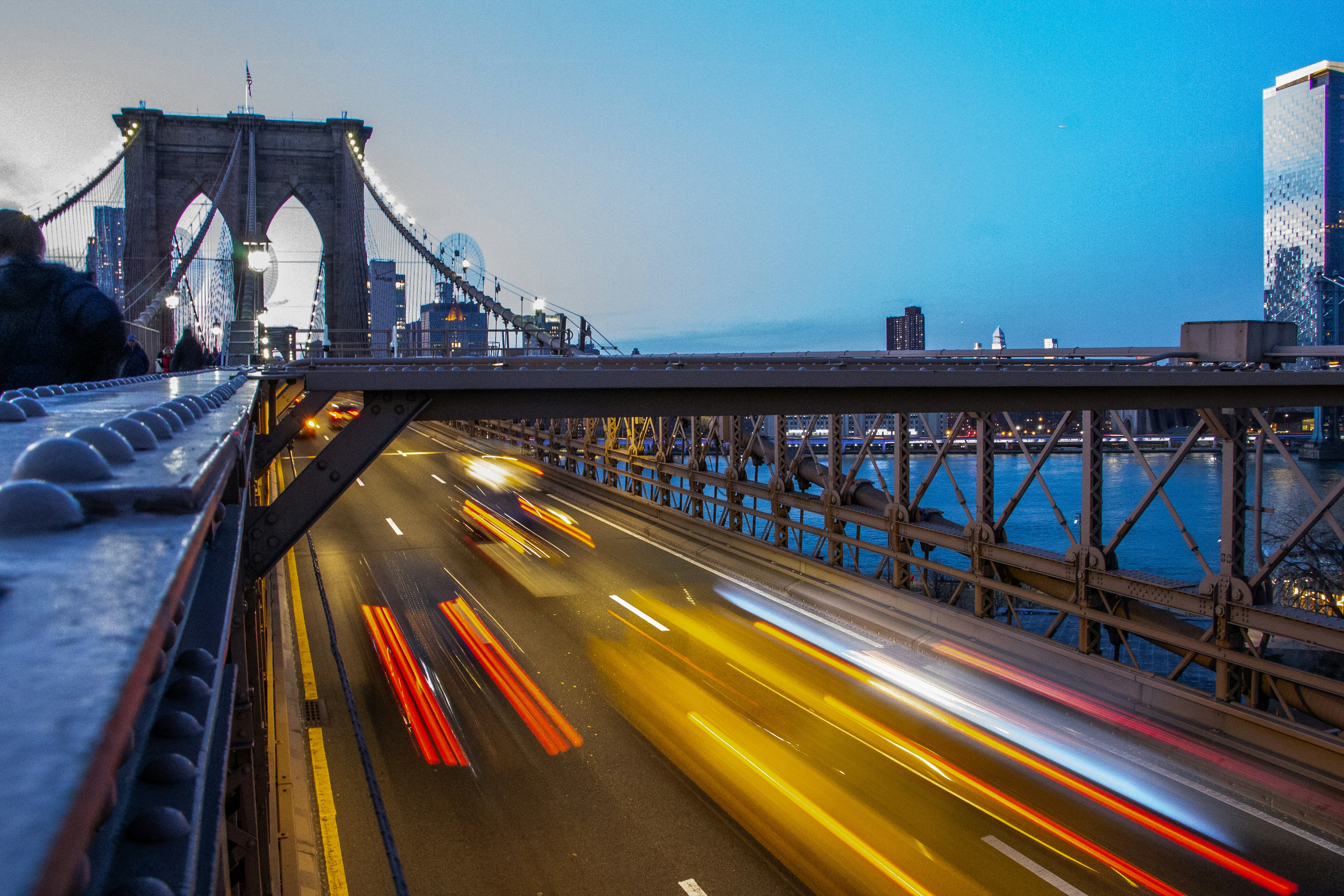 time lapse photography of cars on bridge during night time