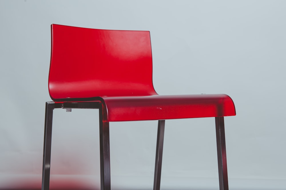 red chair on white table