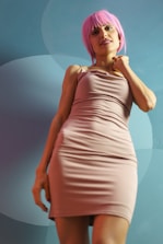 A friendly customer support agent with a pink background.