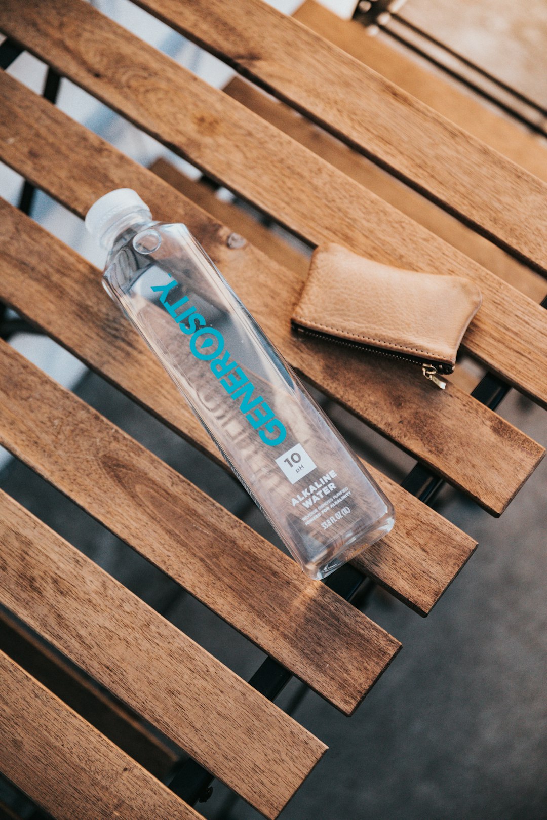white plastic tube bottle on brown wooden plank