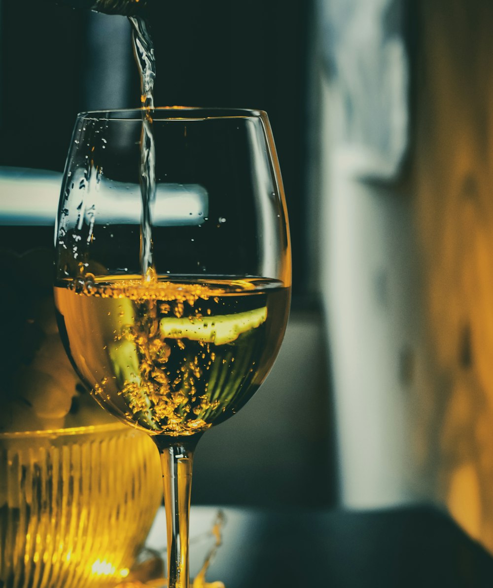 clear wine glass with brown liquid