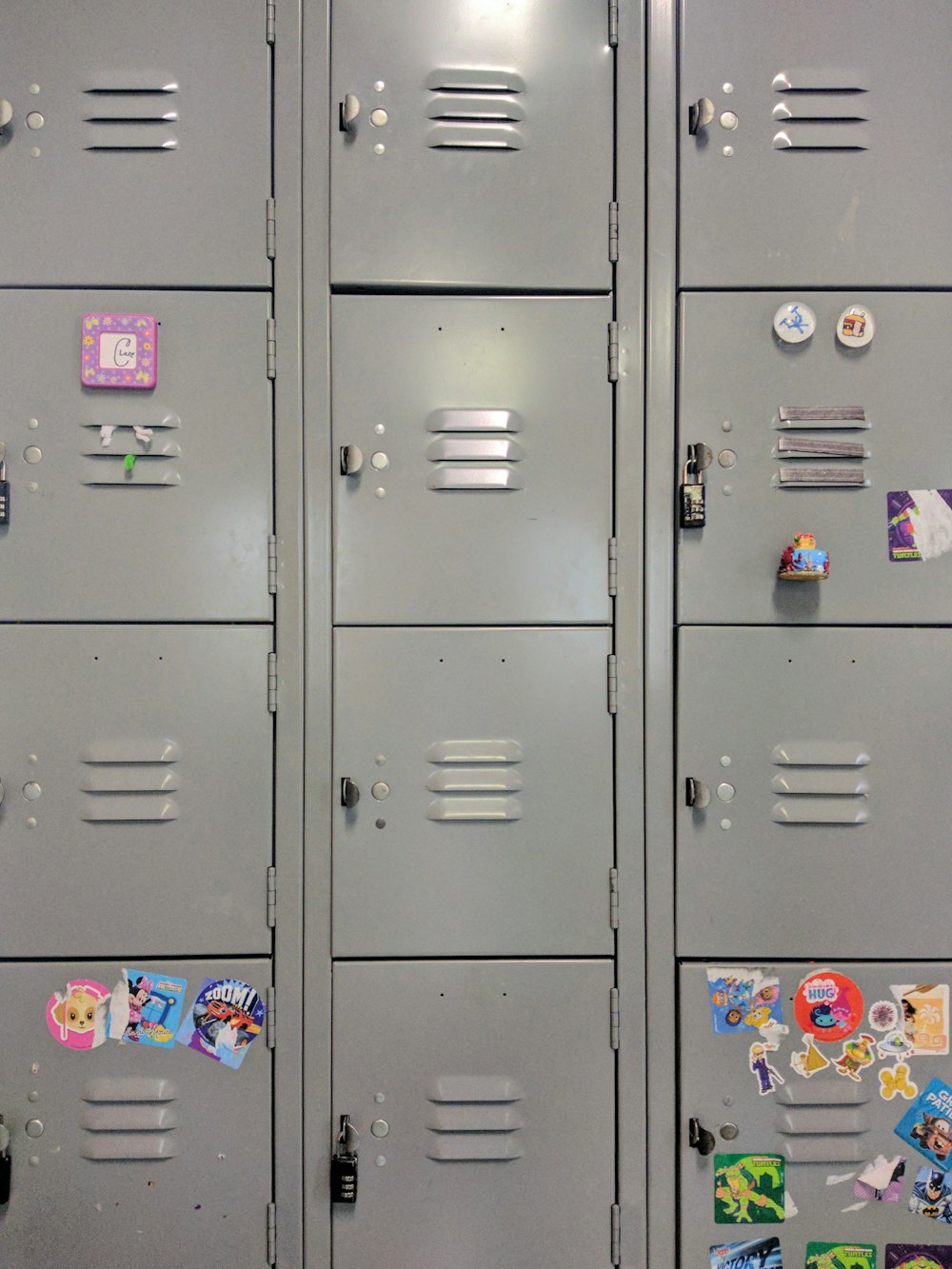 gray steel locker with stickers