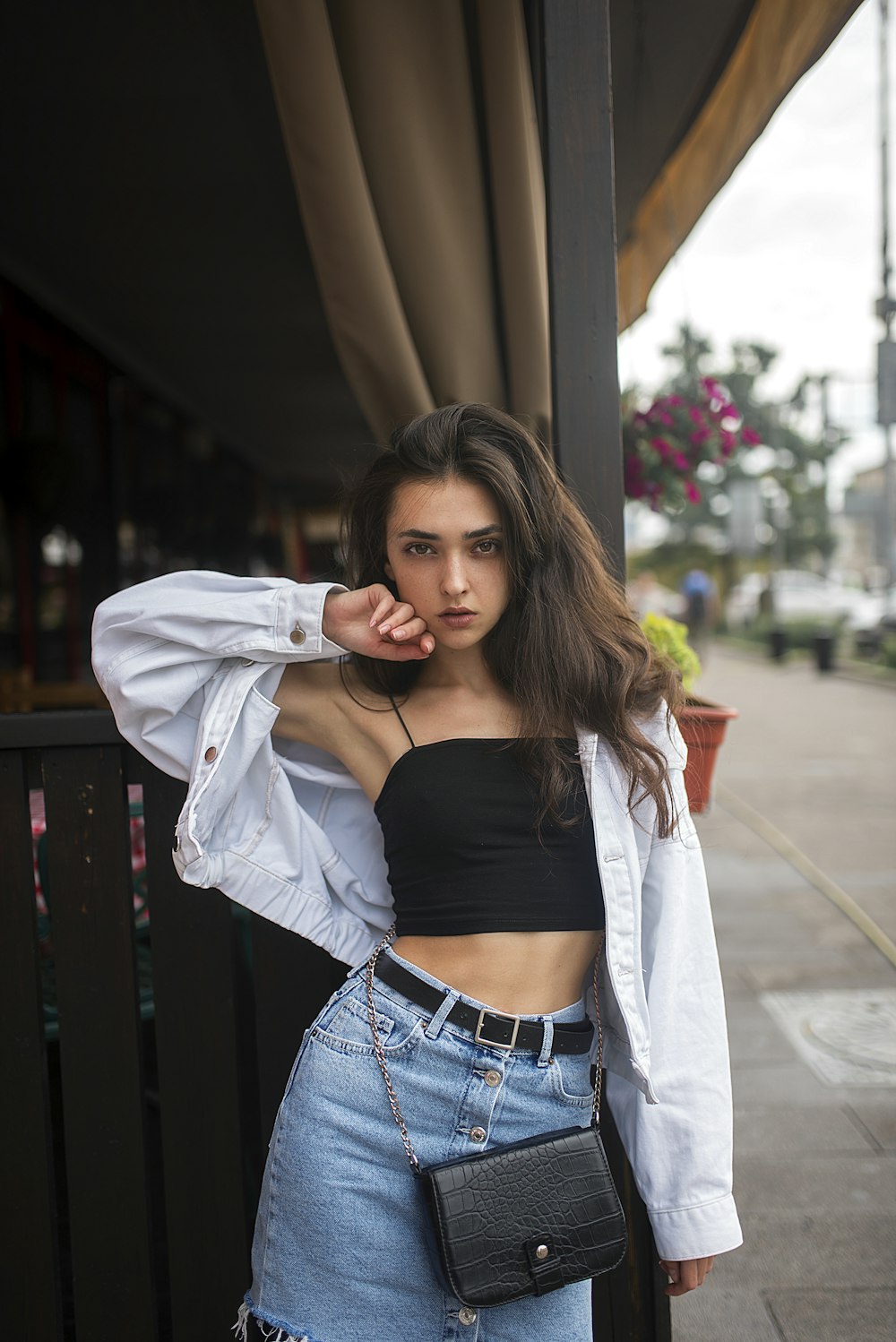 woman in white long sleeve shirt and blue denim skirt