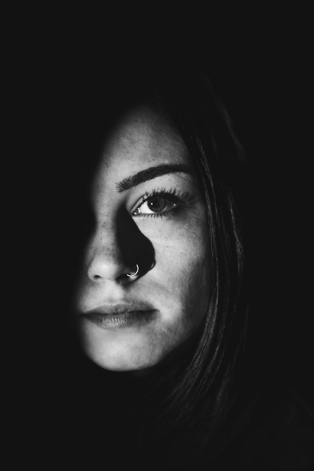 grayscale photo of womans face