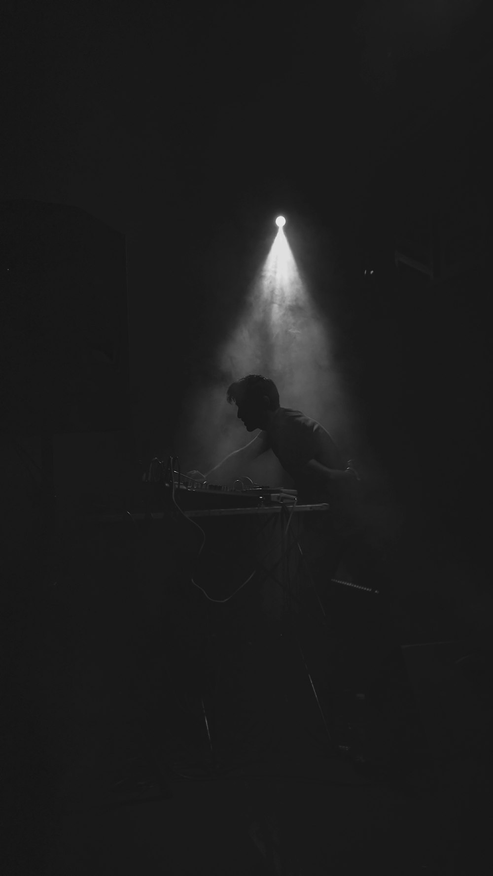 silhouette of man sitting on chair