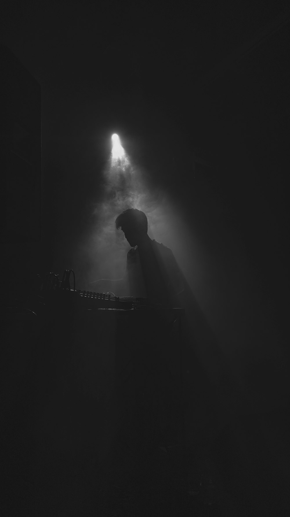 silhouette of man standing on stage