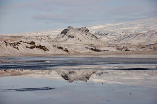 snow covered mountain during daytime in Dyrhólaey Iceland