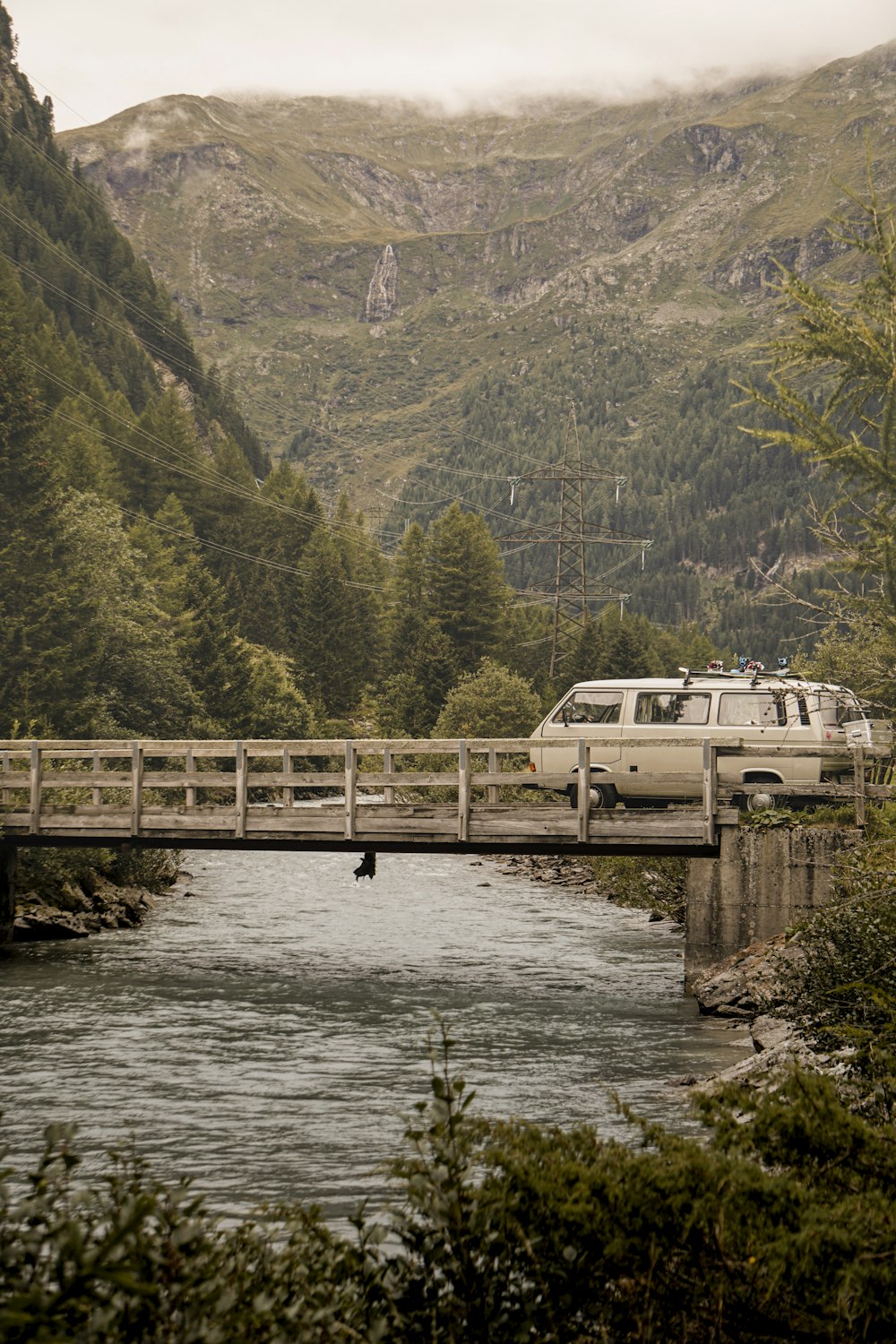 white boat on river near bridge during daytime