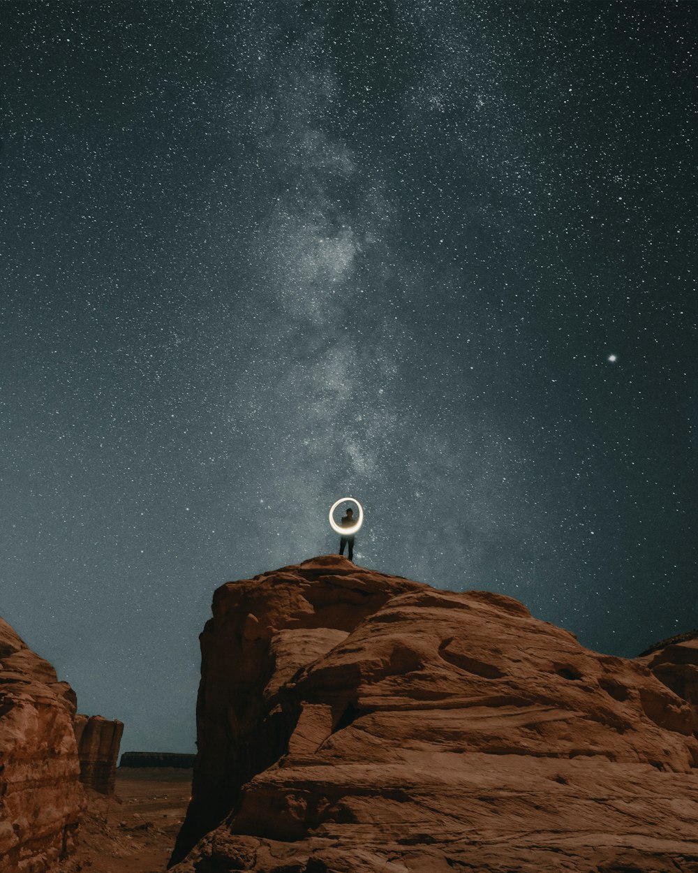 brown rocky mountain under starry night