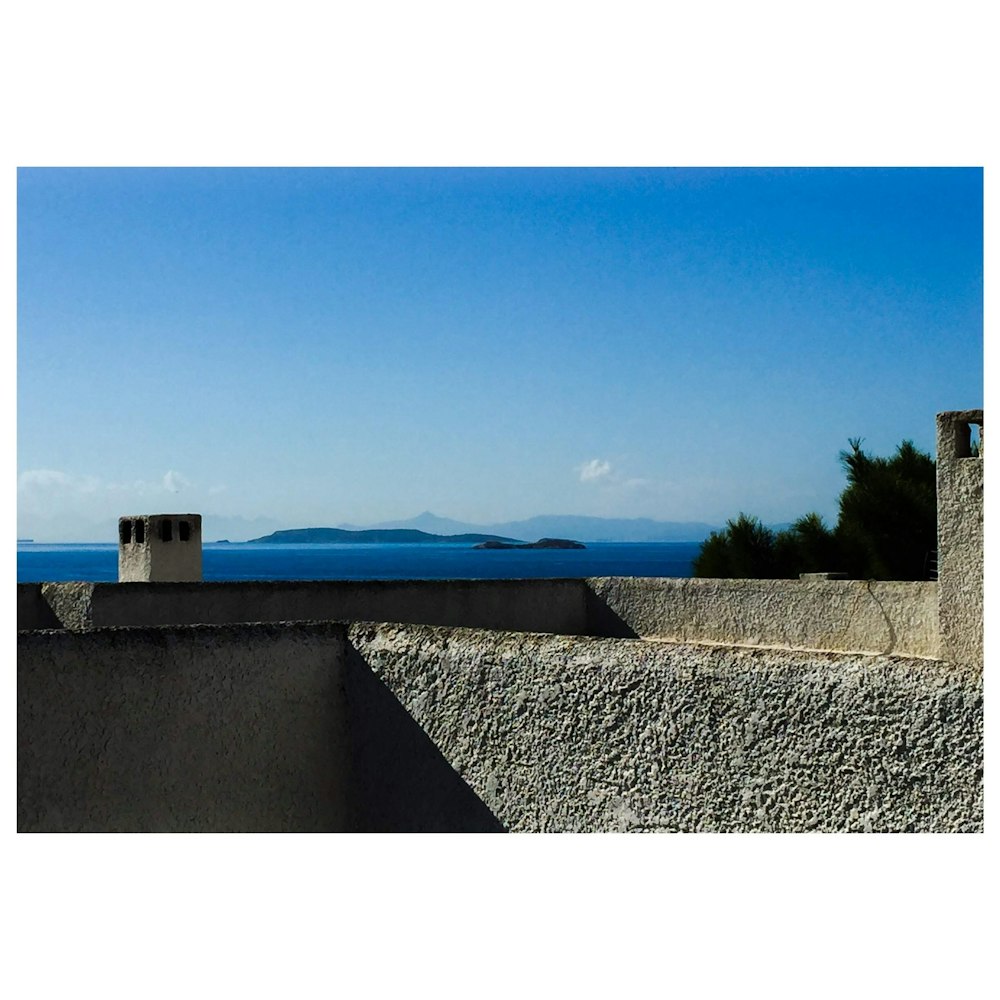 white concrete house under blue sky during daytime