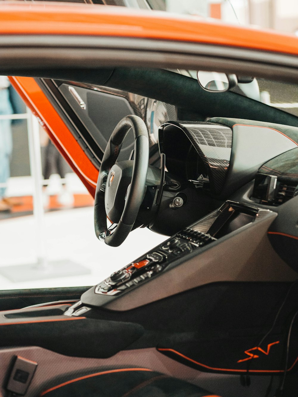 black and red car steering wheel