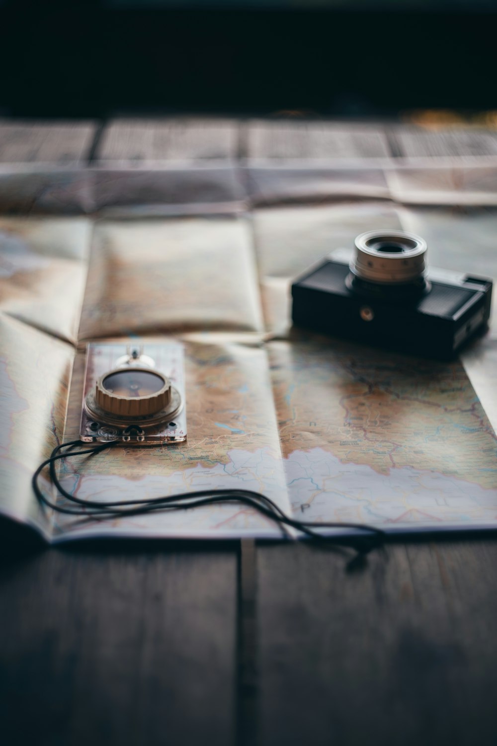 black camera on white textile