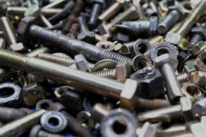 An assortment of colorful scrap metal pieces on a table.