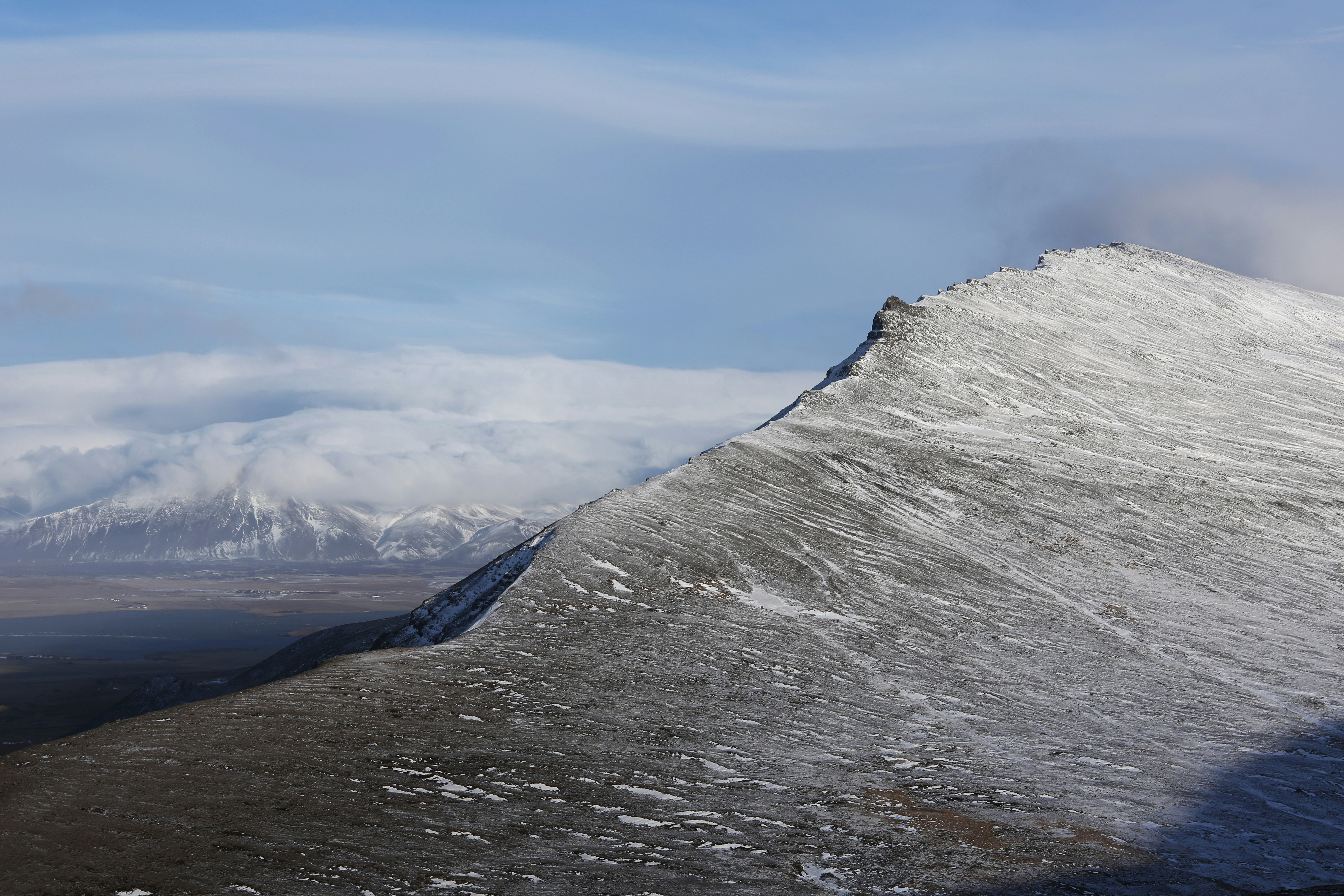 gray rocky mountain under blue sky during daytime