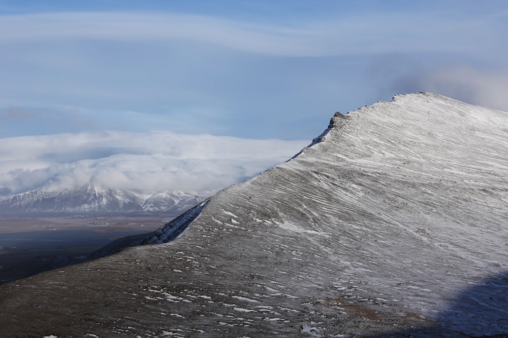 gray rocky mountain under blue sky during daytime