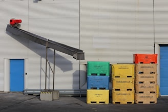 brown cardboard boxes on gray asphalt road during daytime