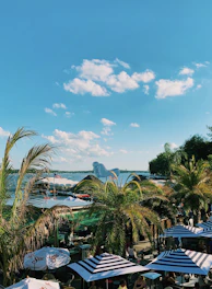 A vibrant outdoor scene featuring solar-powered pumps and patio umbrellas.